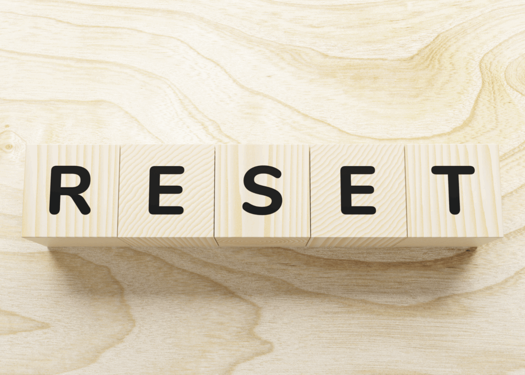 wood blocks spelling out the word "reset"