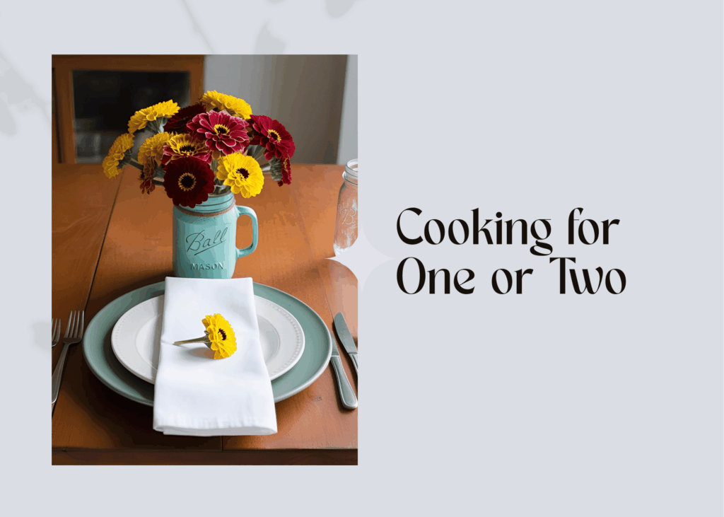 cover photo - with the words "Cooking for One or Two" with a picture of a simple setting on a table for one person with a jar filled with zinnias