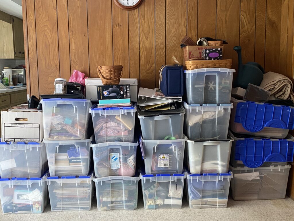 tubs in my "studio", they need to go....plastic tubs filled with stuff.